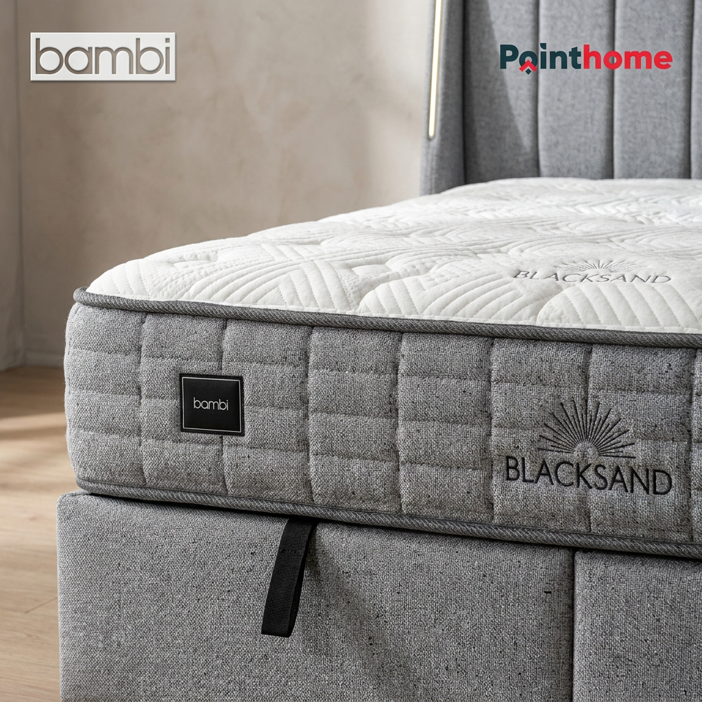 Gros plan du flanc du matelas Blacksand et du sommier coffre gris